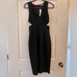 Alice and Olivia black cut out dress. Size 4.